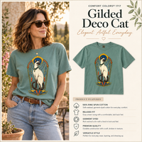 Load image into Gallery viewer, Model in the Bay sage green Gilded Deco Cat tee beside a product features card listing ring-spun cotton and relaxed fit
