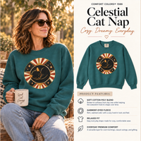 Load image into Gallery viewer, Model in the Blue Spruce Celestial Cat Nap sweatshirt beside a product features card listing cotton-poly blend and garment-dyed fleece
