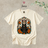 Load image into Gallery viewer, Nine Lives, One Fiesta Day of the Dead black cat t-shirt with marigolds in Ivory, Comfort Colors
