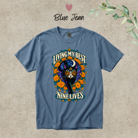 Load image into Gallery viewer, Living My Best Nine Lives Day of the Dead black cat t-shirt with marigolds in Blue Jean, Comfort Colors
