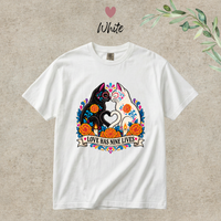Load image into Gallery viewer, Love Has Nine Lives Brights Day of the Dead black cat t-shirt in White, Comfort Colors

