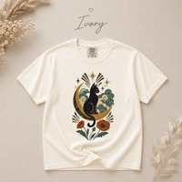 Load image into Gallery viewer, Black cat and crescent moon illustration with poppies, shown on a soft garment-dyed cat mom t-shirt
