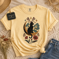 Load image into Gallery viewer, Moonlit Poppy Cat Tee — black cat resting beneath a golden crescent moon with poppies and stars, on a garment-dyed Comfort Colors t-shirt
